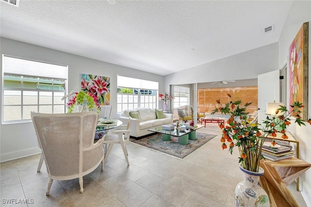 3128 Andorra Ct, Naples, FL 34109 - living room with a textured ceiling and light tile patterned floors