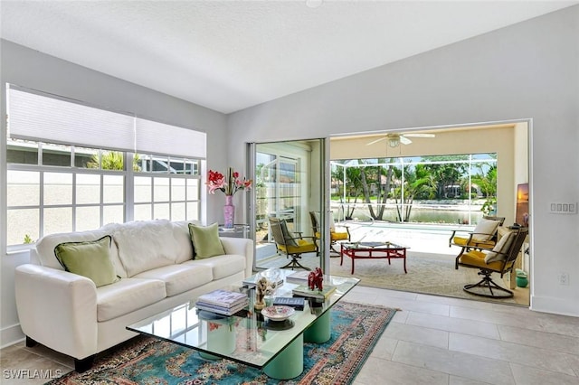 3128 Andorra Ct, Naples, FL 34109 - living room with ceiling fan, tile patterned flooring, and lofted ceiling
