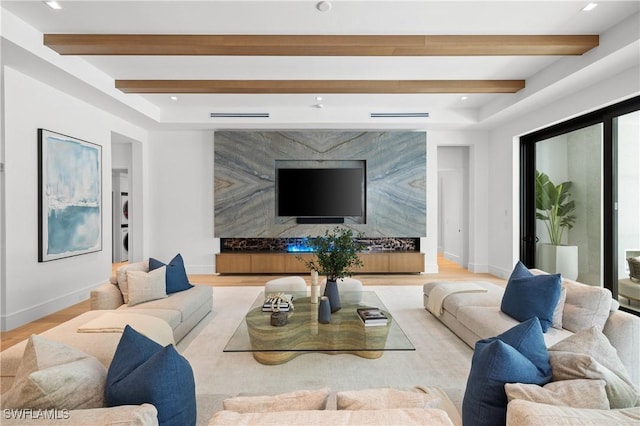 850 10th St N, Naples, FL 34102 - living room featuring beam ceiling and light wood-style flooring