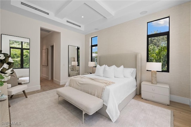 850 10th St N, Naples, FL 34102 - bedroom with light wood-type flooring, beamed ceiling, and coffered ceiling