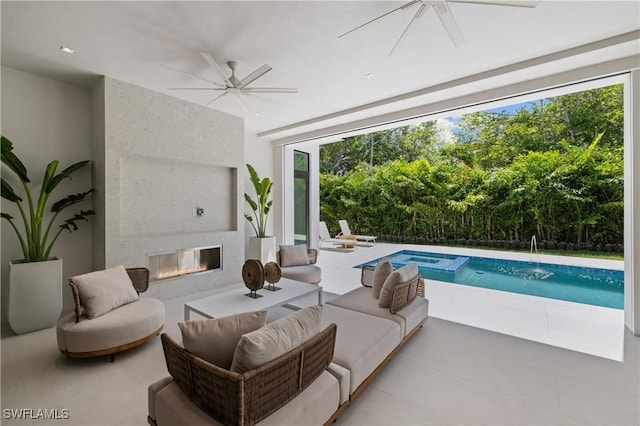 850 10th St N, Naples, FL 34102 - view of pool with a ceiling fan, a patio area, an outdoor living space with a fireplace, and a pool with connected hot tub