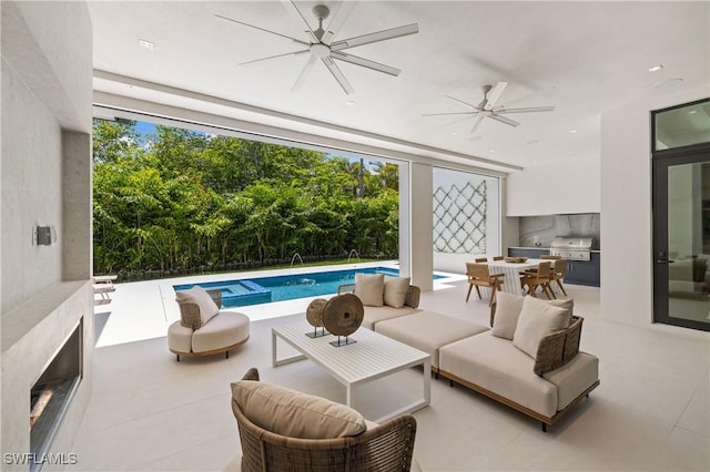 850 10th St N, Naples, FL 34102 - view of patio / terrace with a ceiling fan, an outdoor living space, an outdoor kitchen, and an outdoor pool