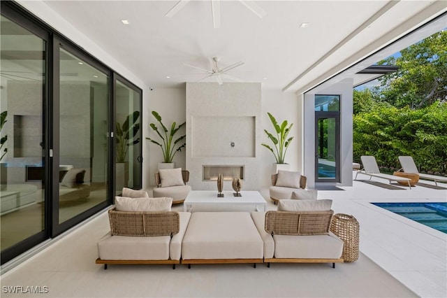 850 10th St N, Naples, FL 34102 - view of patio with a ceiling fan, an outdoor living space with a fireplace, and an outdoor pool