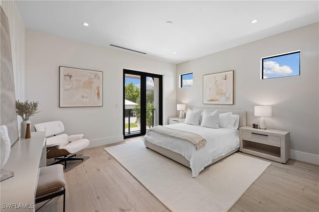 850 10th St N, Naples, FL 34102 - bedroom featuring access to exterior, light wood-style floors, and recessed lighting