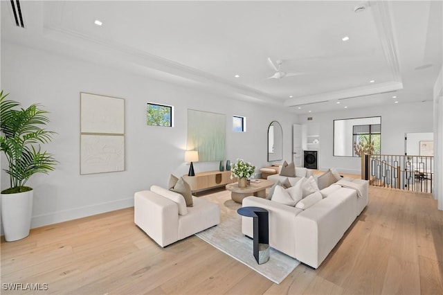 850 10th St N, Naples, FL 34102 - living area with a raised ceiling, recessed lighting, light wood-style flooring, a ceiling fan, and washer / dryer