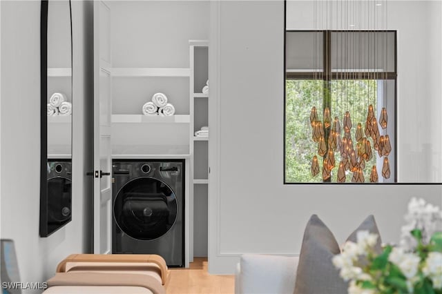 850 10th St N, Naples, FL 34102 - laundry area with washer / clothes dryer and wood finished floors