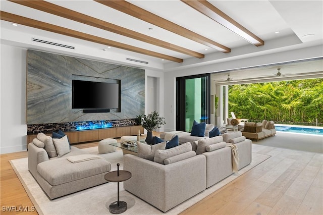 850 10th St N, Naples, FL 34102 - living room with wood finished floors and beam ceiling
