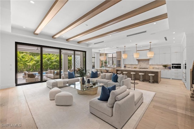 850 10th St N, Naples, FL 34102 - living area with light wood-type flooring, recessed lighting, and beam ceiling