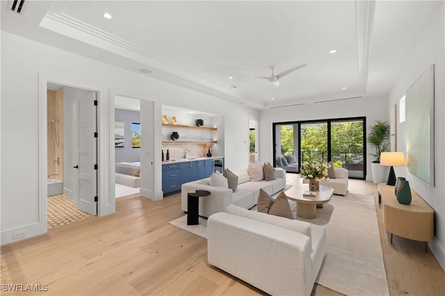 850 10th St N, Naples, FL 34102 - living room with a tray ceiling, light wood-type flooring, recessed lighting, a ceiling fan, and wine cooler