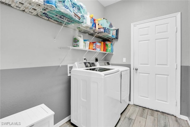 8094 Silver Birch Way, Lehigh Acres, FL 33971 - laundry room featuring washing machine and clothes dryer and light wood-type flooring