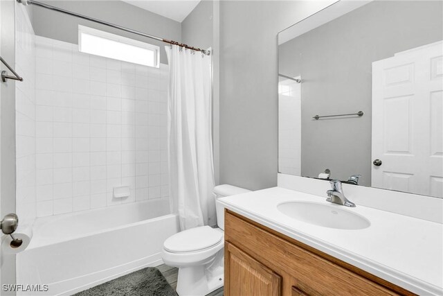 8094 Silver Birch Way, Lehigh Acres, FL 33971 - bathroom with shower / tub combo with curtain and vanity