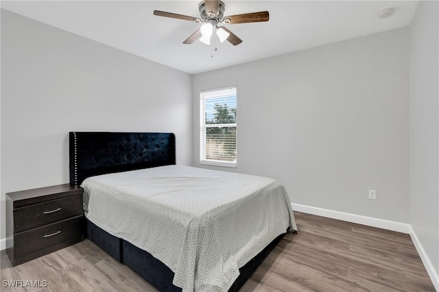 8094 Silver Birch Way, Lehigh Acres, FL 33971 - bedroom featuring wood finished floors and a ceiling fan