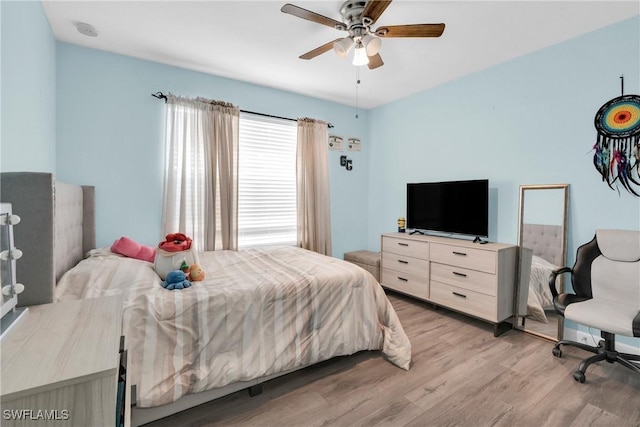 8094 Silver Birch Way, Lehigh Acres, FL 33971 - bedroom featuring light wood-style flooring and ceiling fan