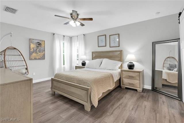 8094 Silver Birch Way, Lehigh Acres, FL 33971 - bedroom featuring wood finished floors and ceiling fan