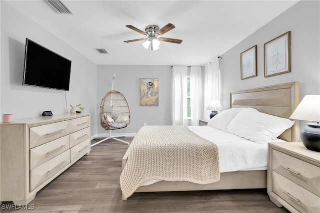 8094 Silver Birch Way, Lehigh Acres, FL 33971 - bedroom with a ceiling fan and light wood-style flooring