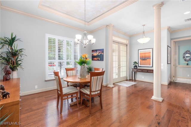 3681 Mossy Oak Dr, Fort Myers, FL 33905 - dining area with decorative columns, wood finished floors, ornamental molding, and a chandelier