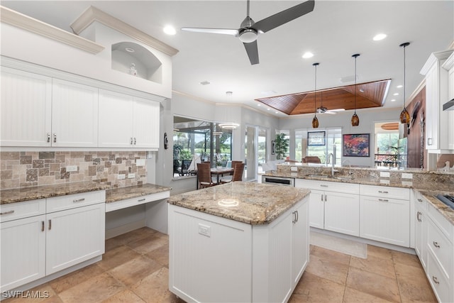 3681 Mossy Oak Dr, Fort Myers, FL 33905 - kitchen with ceiling fan, a peninsula, backsplash, hanging light fixtures, and crown molding