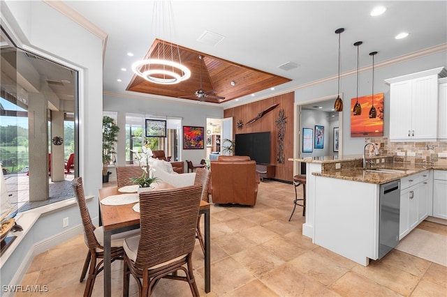 3681 Mossy Oak Dr, Fort Myers, FL 33905 - dining space featuring a raised ceiling, recessed lighting, a ceiling fan, crown molding, and light stone finish floors