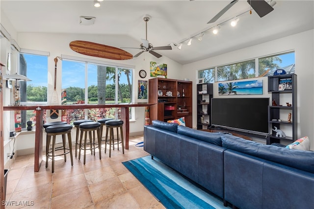 3681 Mossy Oak Dr, Fort Myers, FL 33905 - living area with a ceiling fan, vaulted ceiling, track lighting, and light stone finish flooring