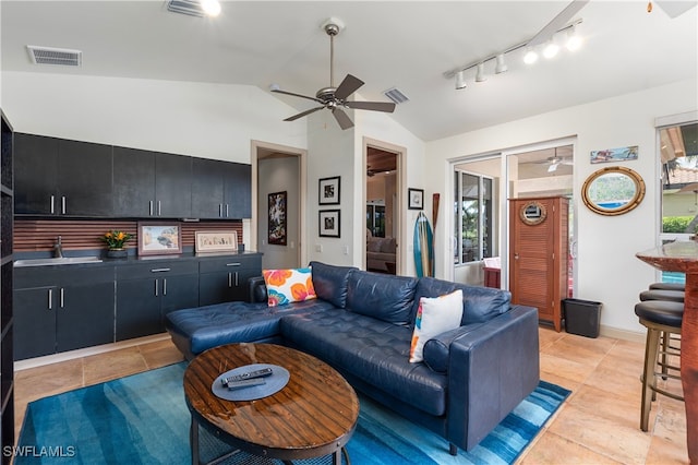 3681 Mossy Oak Dr, Fort Myers, FL 33905 - living area featuring ceiling fan, vaulted ceiling, light tile patterned flooring, rail lighting, and plenty of natural light
