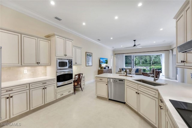 6632 Glen Arbor Way, Naples, FL 34119 - kitchen with appliances with stainless steel finishes, cream cabinetry, ceiling fan, light countertops, and recessed lighting