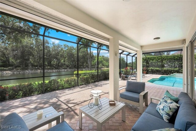 6632 Glen Arbor Way, Naples, FL 34119 - sunroom / solarium featuring a water view, an outdoor hangout area, and view of wooded area
