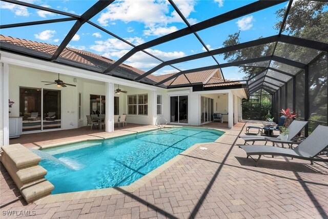 6632 Glen Arbor Way, Naples, FL 34119 - outdoor pool with a ceiling fan, a patio, and glass enclosure