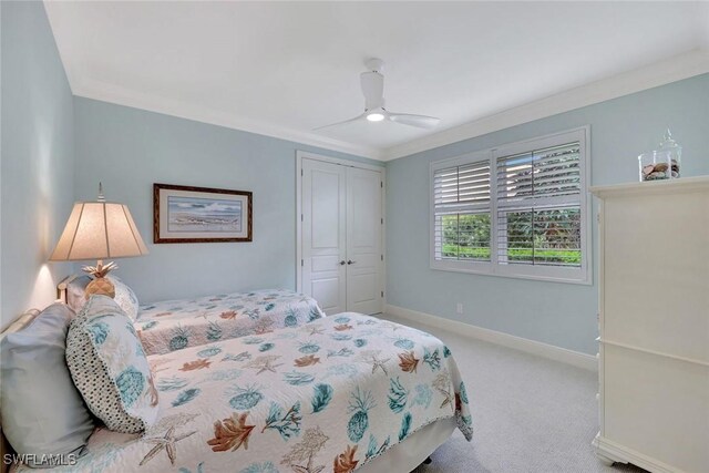 6632 Glen Arbor Way, Naples, FL 34119 - bedroom with ornamental molding, carpet flooring, a closet, and a ceiling fan