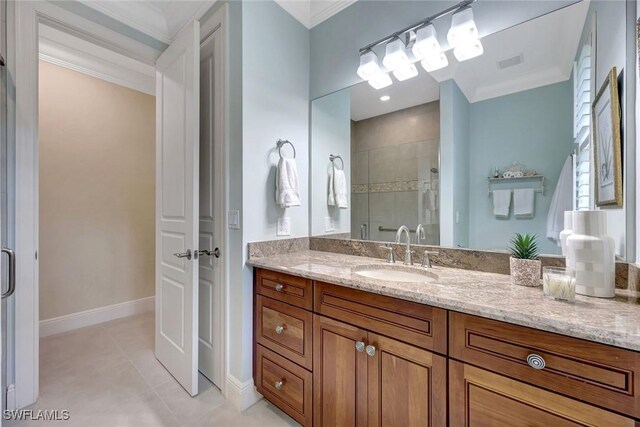 6632 Glen Arbor Way, Naples, FL 34119 - full bathroom with a shower stall, vanity, crown molding, and tile patterned flooring