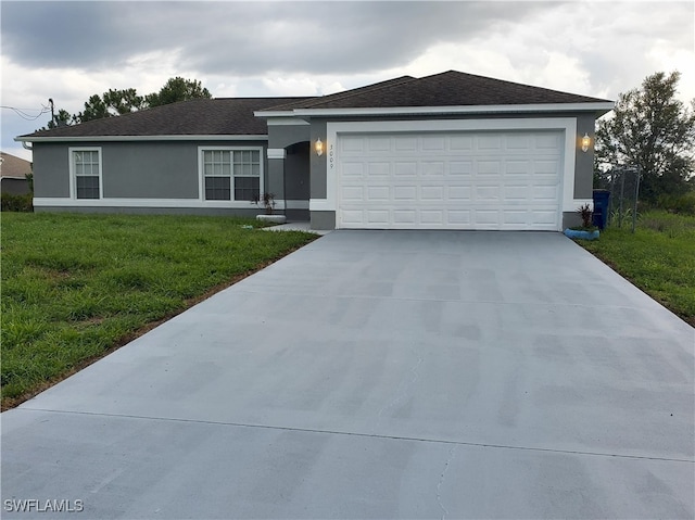 3009 44th St W, Lehigh Acres, FL 33971 - single story home featuring stucco siding, concrete driveway, a front lawn, and a garage