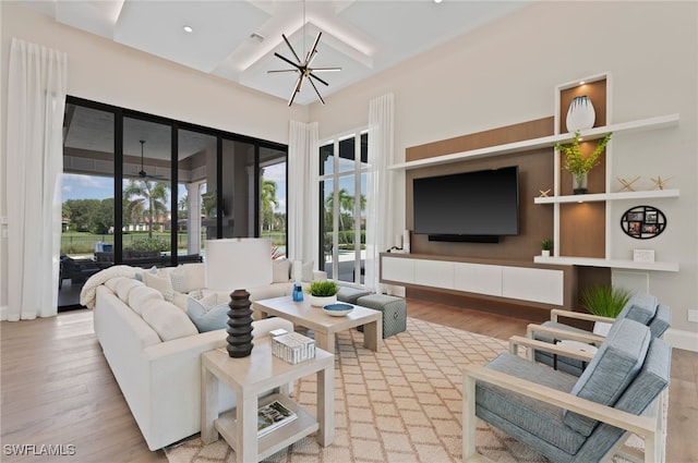 4297 Deephaven Ln, Naples, FL 34119 - living area featuring coffered ceiling, wood finished floors, and beamed ceiling