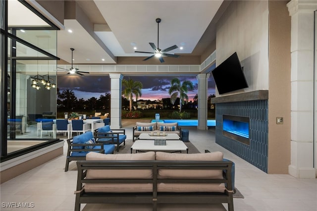 4297 Deephaven Ln, Naples, FL 34119 - view of patio featuring a ceiling fan and an outdoor living space with a fireplace