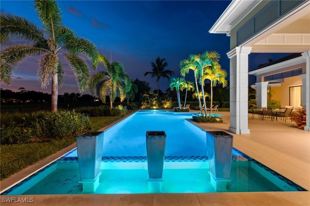 4297 Deephaven Ln, Naples, FL 34119 - view of pool with an infinity pool and a patio area