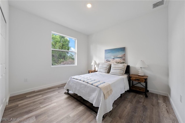 2429/2431 Lola Ave S, Lehigh Acres, FL 33973 - bedroom featuring wood finished floors and baseboards