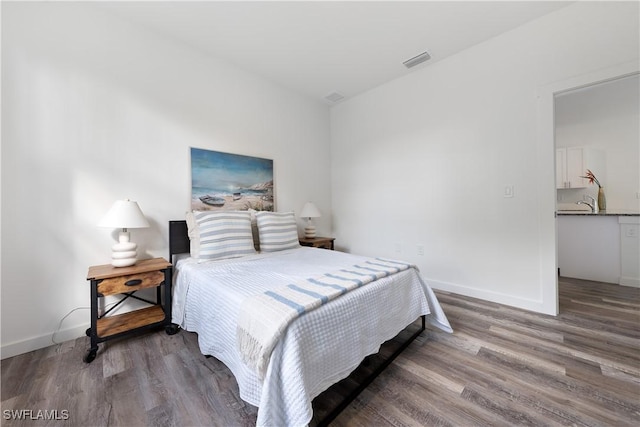 2429/2431 Lola Ave S, Lehigh Acres, FL 33973 - bedroom with wood finished floors and baseboards