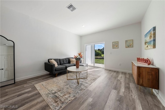 2429/2431 Lola Ave S, Lehigh Acres, FL 33973 - living room featuring wood finished floors