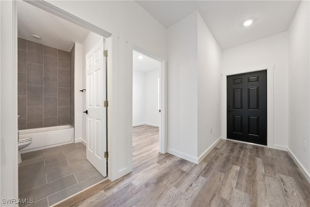 2429/2431 Lola Ave S, Lehigh Acres, FL 33973 - entrance foyer featuring wood finished floors and recessed lighting