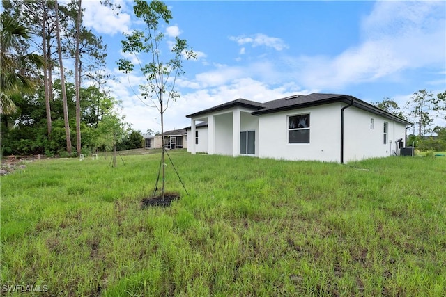 2429/2431 Lola Ave S, Lehigh Acres, FL 33973 - back of property with stucco siding