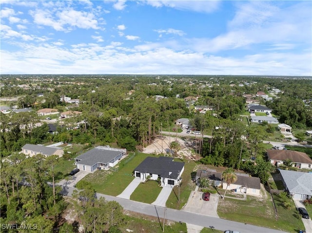 2429/2431 Lola Ave S, Lehigh Acres, FL 33973 - aerial overview of property's location with nearby suburban area