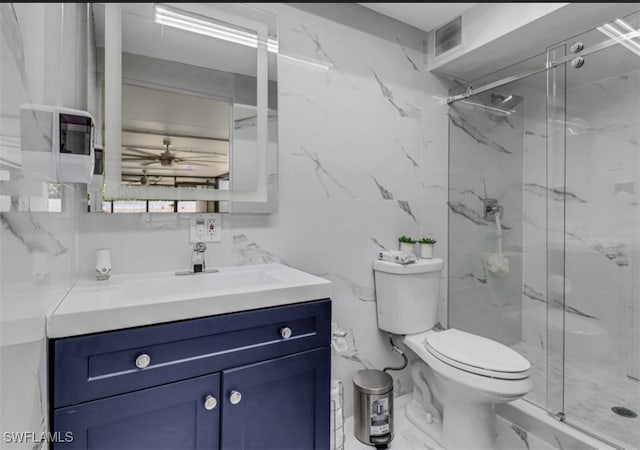 4442 18th Ave SW, Naples, FL 34116 - full bath with vanity, a marble finish shower, tile walls, a ceiling fan, and marble finish flooring