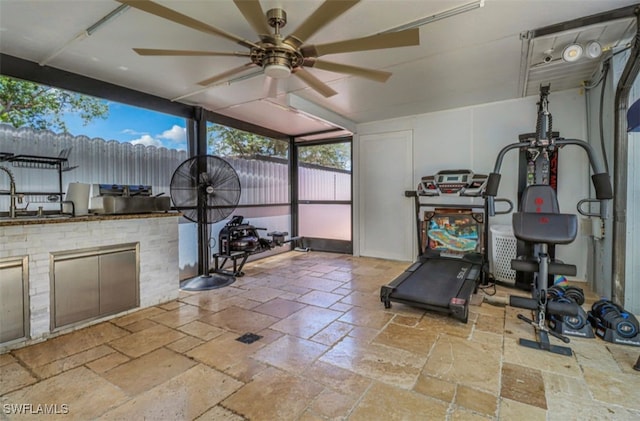 4442 18th Ave SW, Naples, FL 34116 - workout area with stone tile flooring and a ceiling fan