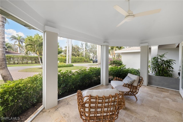 320 Putter Point Dr, Naples, FL 34103 - sunroom / solarium featuring stone tile flooring, a ceiling fan, and healthy amount of natural light