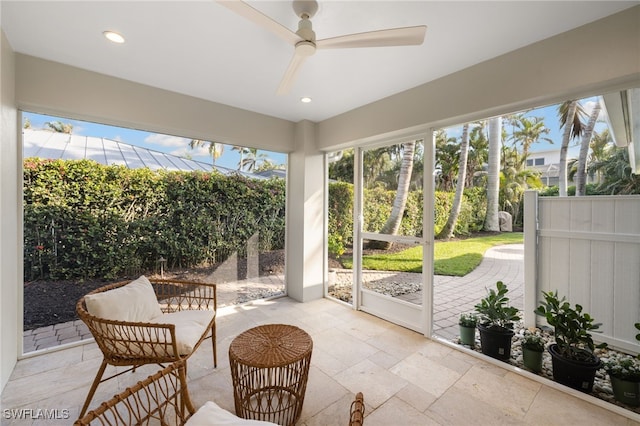 320 Putter Point Dr, Naples, FL 34103 - sunroom / solarium featuring a ceiling fan