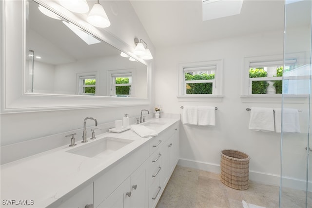 320 Putter Point Dr, Naples, FL 34103 - bathroom with a skylight, lofted ceiling, double vanity, and a shower with door