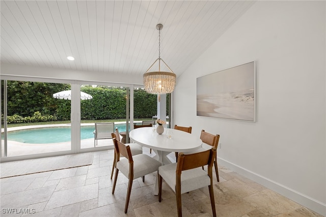 320 Putter Point Dr, Naples, FL 34103 - dining space with stone tile floors, a chandelier, wooden ceiling, and vaulted ceiling