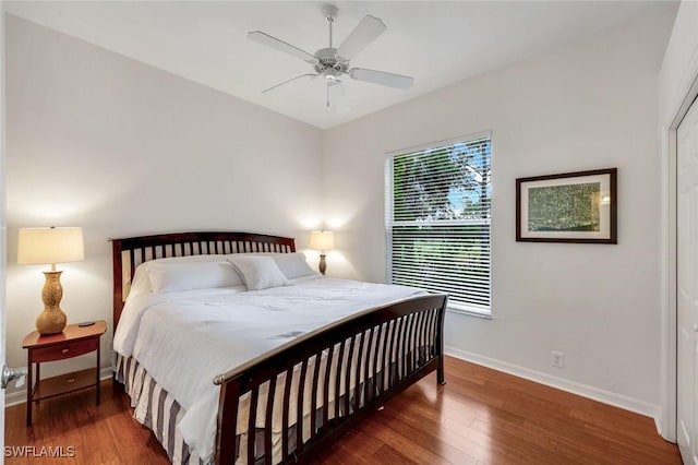 8621 Gleneagle Way, Naples, FL 34120 - bedroom featuring wood finished floors and ceiling fan