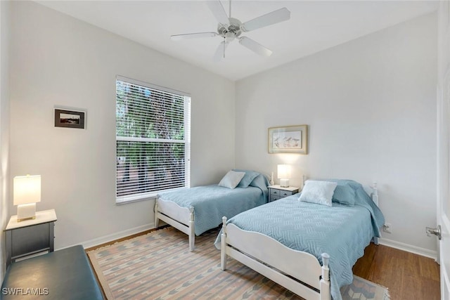 8621 Gleneagle Way, Naples, FL 34120 - bedroom featuring wood finished floors and ceiling fan
