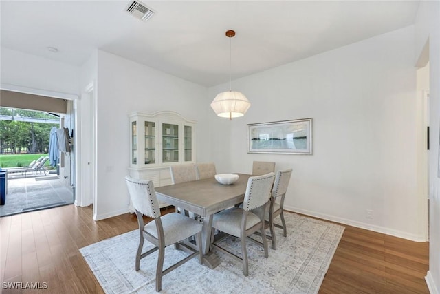 8621 Gleneagle Way, Naples, FL 34120 - dining area featuring wood finished floors