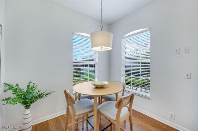 8621 Gleneagle Way, Naples, FL 34120 - dining area with wood finished floors and plenty of natural light