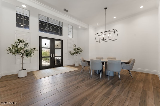 2274 Hawksridge Dr, Naples, FL 34105 - dining space featuring french doors, wood finished floors, recessed lighting, ornamental molding, and a chandelier